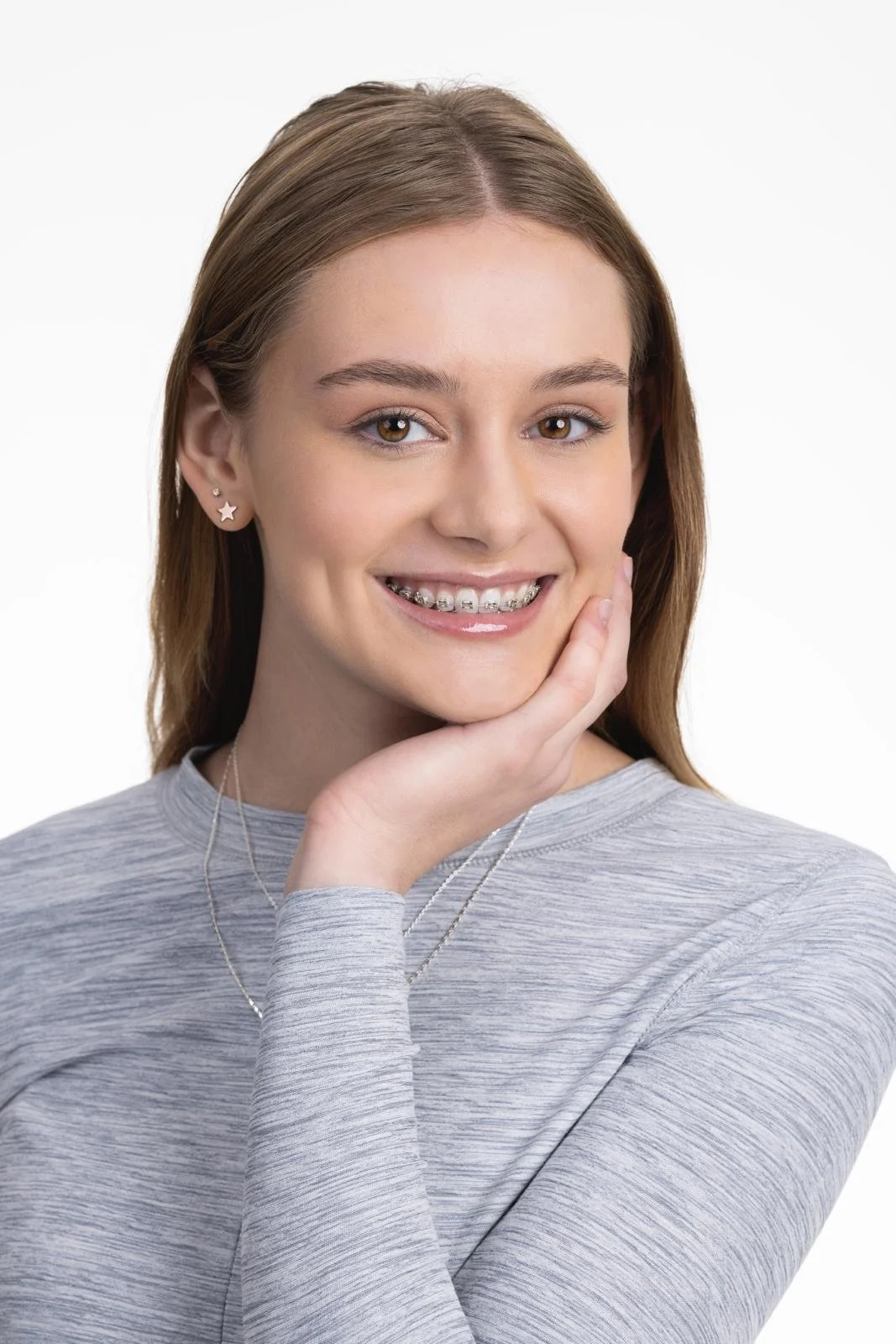 Patient with braces smiling at Nexus Orthodontics