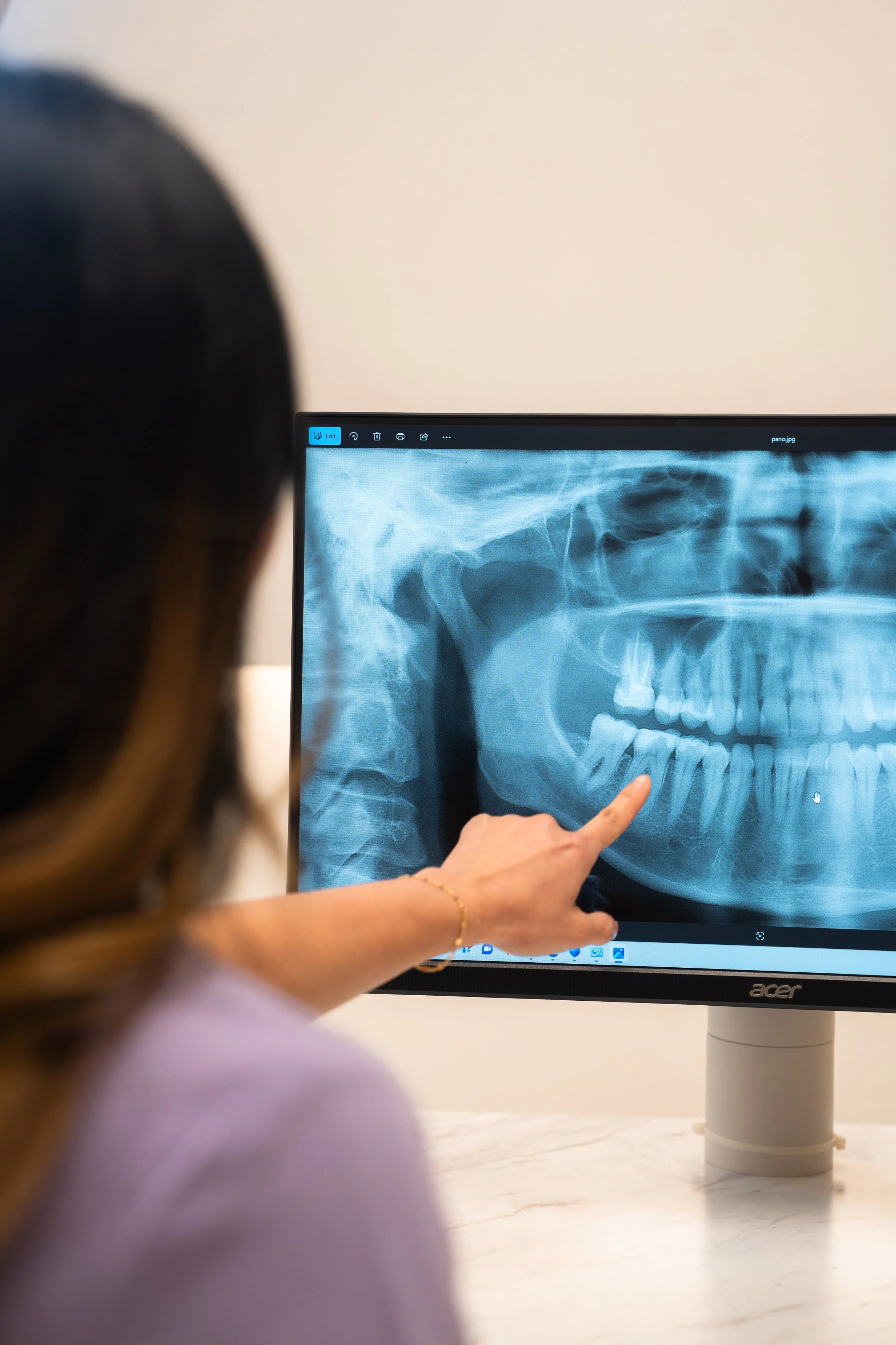 Orthodontist reviewing dental X-ray